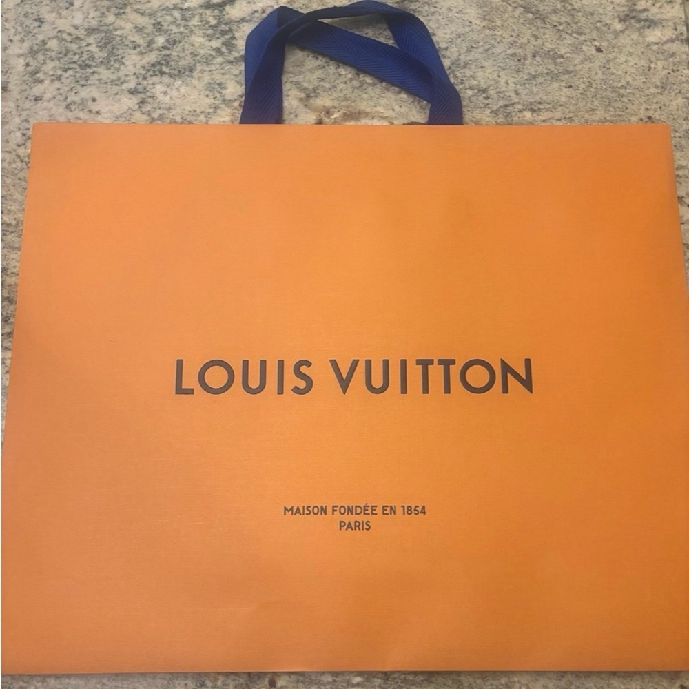 Louis Vuitton shopping bag, box, ribbon, and receipt holder